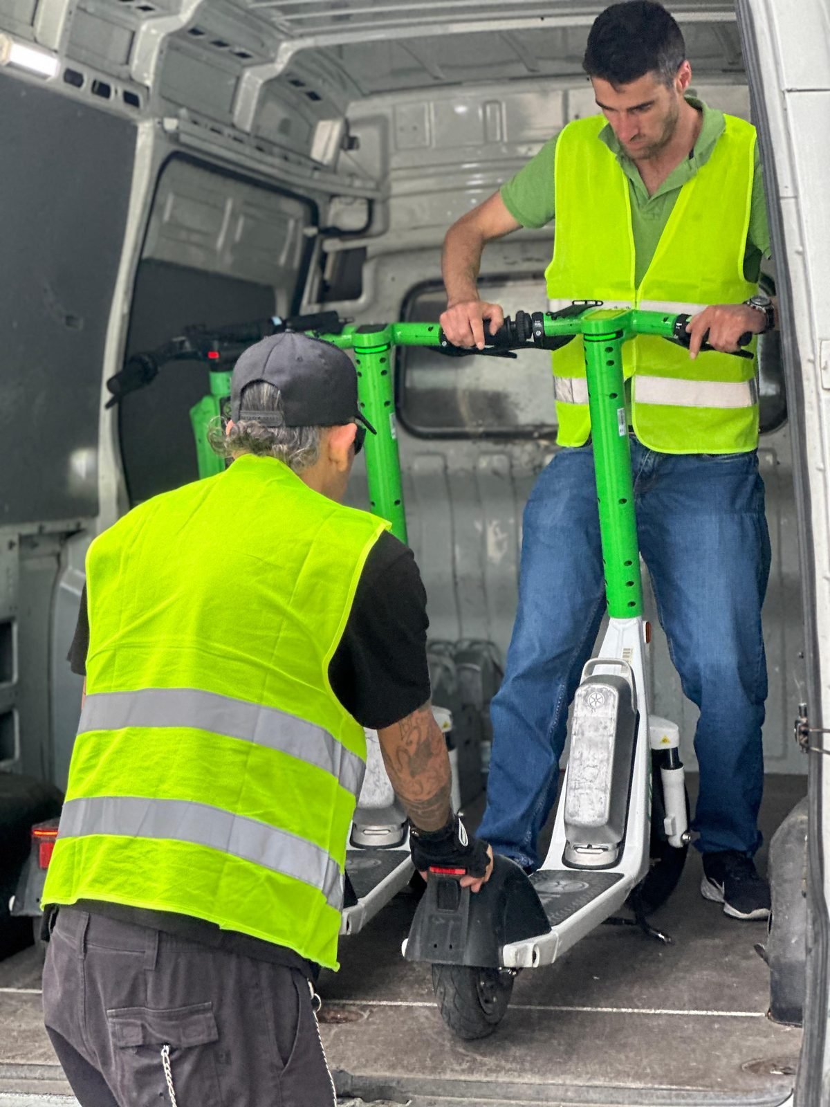 Binny Mobility crew loading e-scooter for retrieval