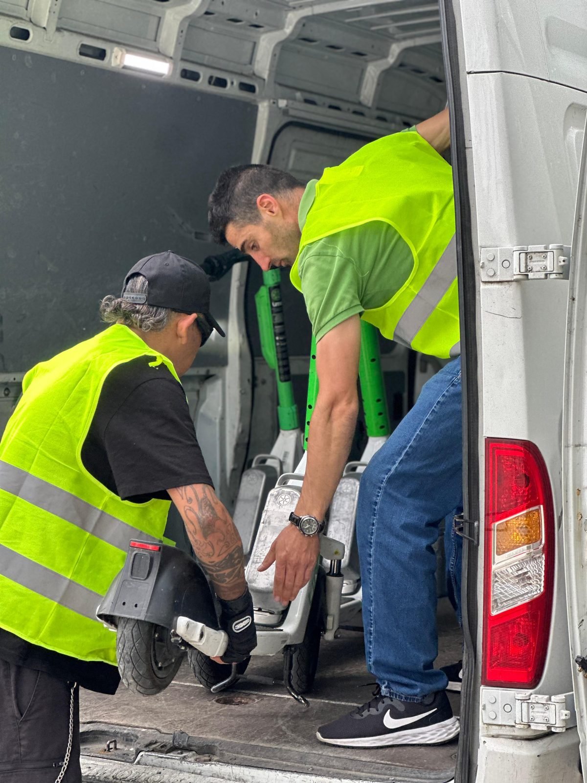 Binny Mobility crew collaborating inside an operations van